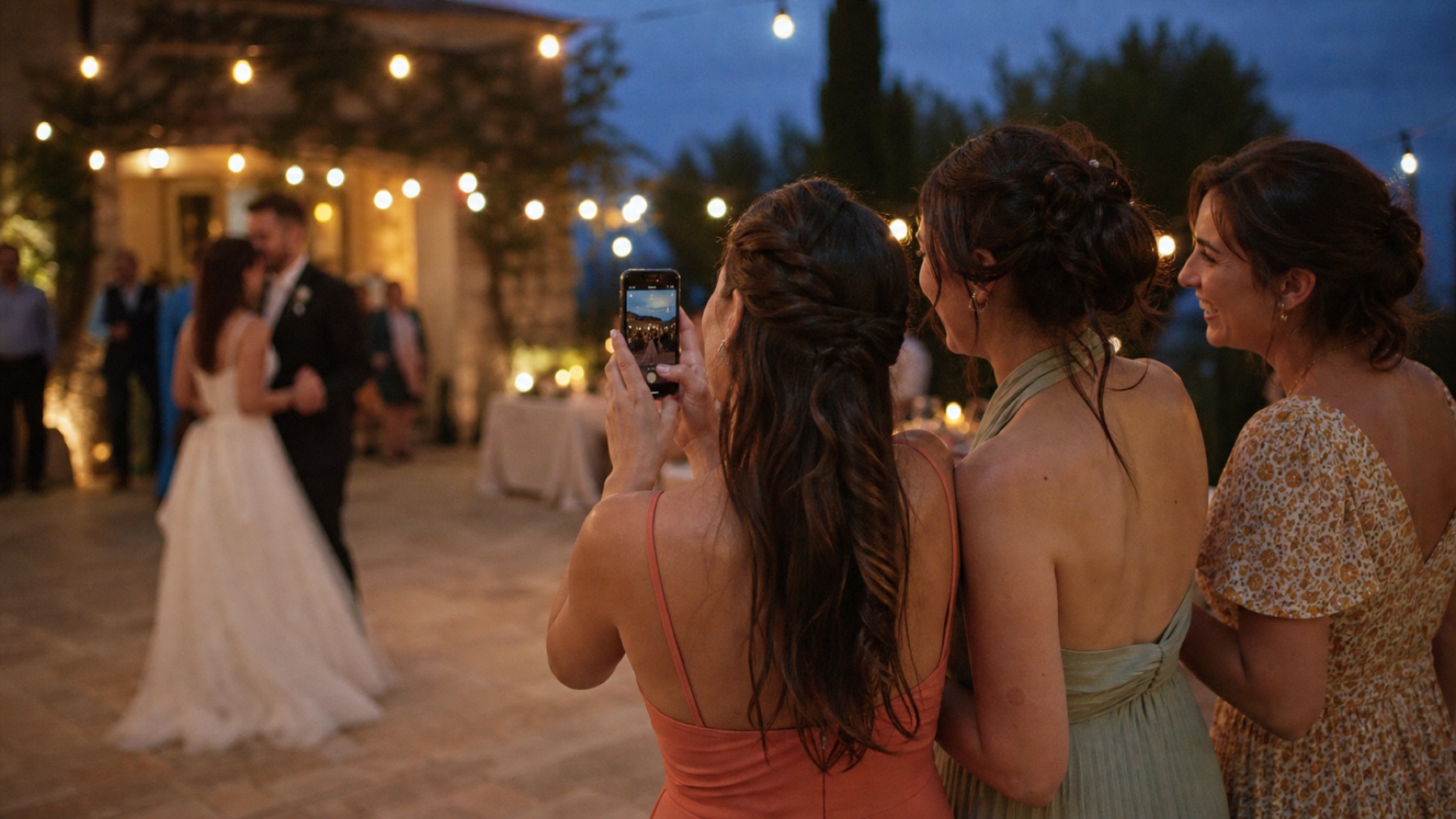 A wedding guest giving a speech to a room of seated guests